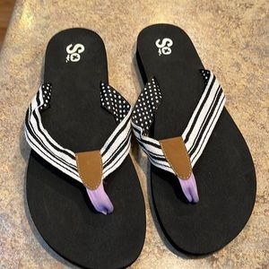 Black  striped purple tie flip flops. Good condition